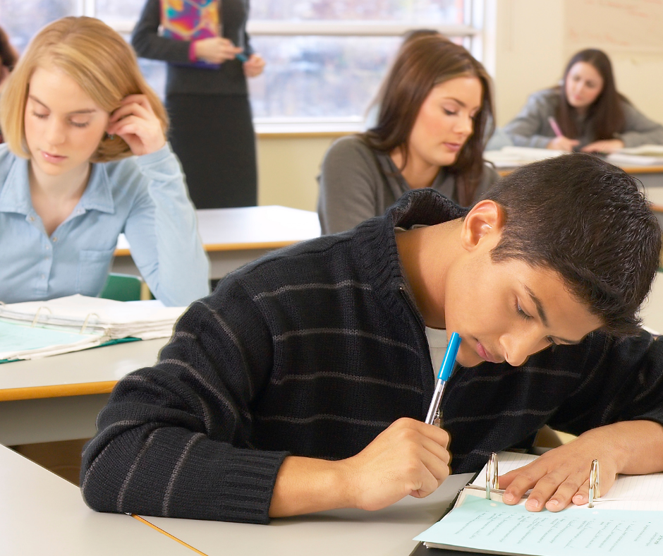students in class taking a test