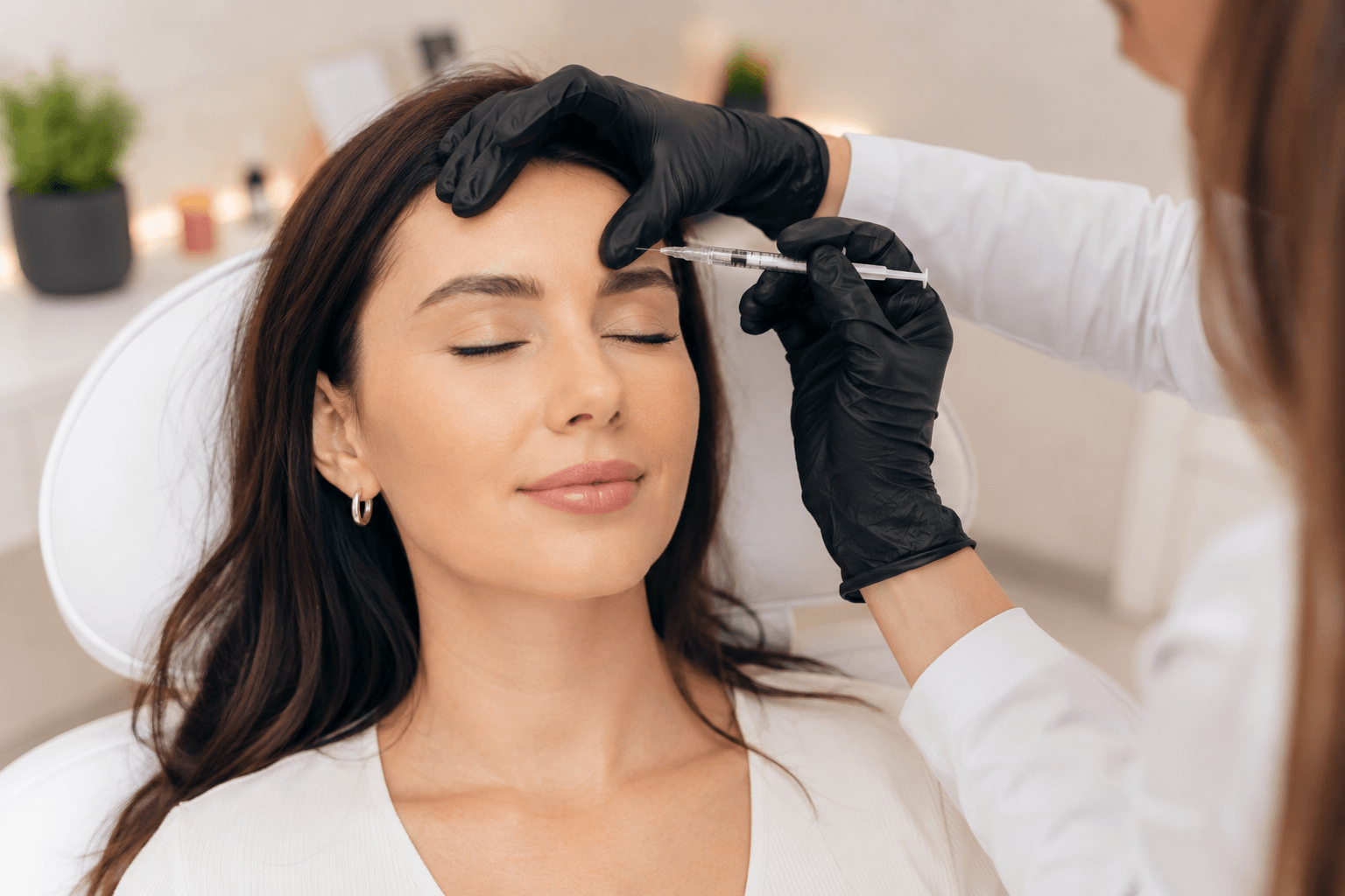 Injector performing forehead Botox treatment at a medspa in Estes Park, Colorado to soften horizontal wrinkles naturally