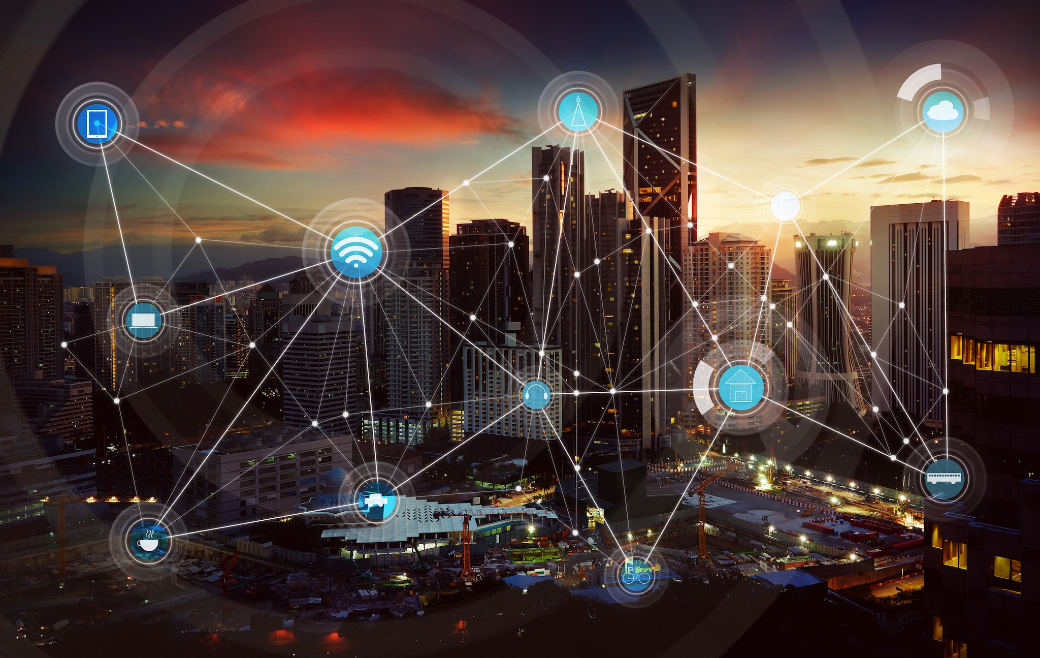 Futuristic depiction of a city skyline at night with a graphic showing interconnectivity and electricity