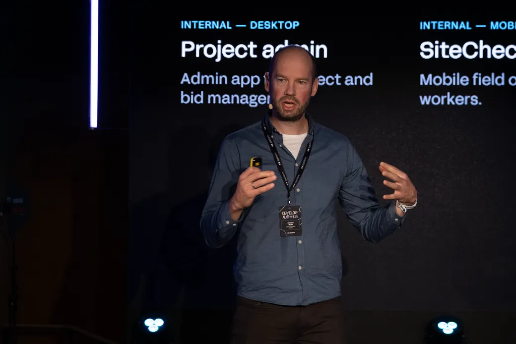 Kristian Mella on stage at Developalooza 2026, presenting the four levels of enterprise AI.