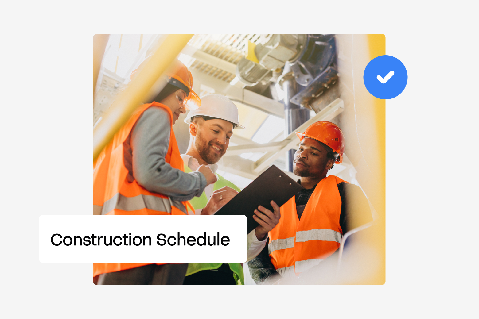 Construction team in hard hats and hi-vis vests reviewing a construction schedule on a clipboard