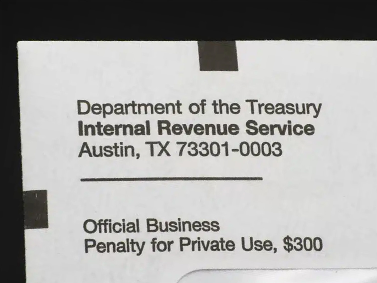 Close-up of an official IRS envelope from the Department of the Treasury in Austin, Texas, addressed for official business with penalty notice.