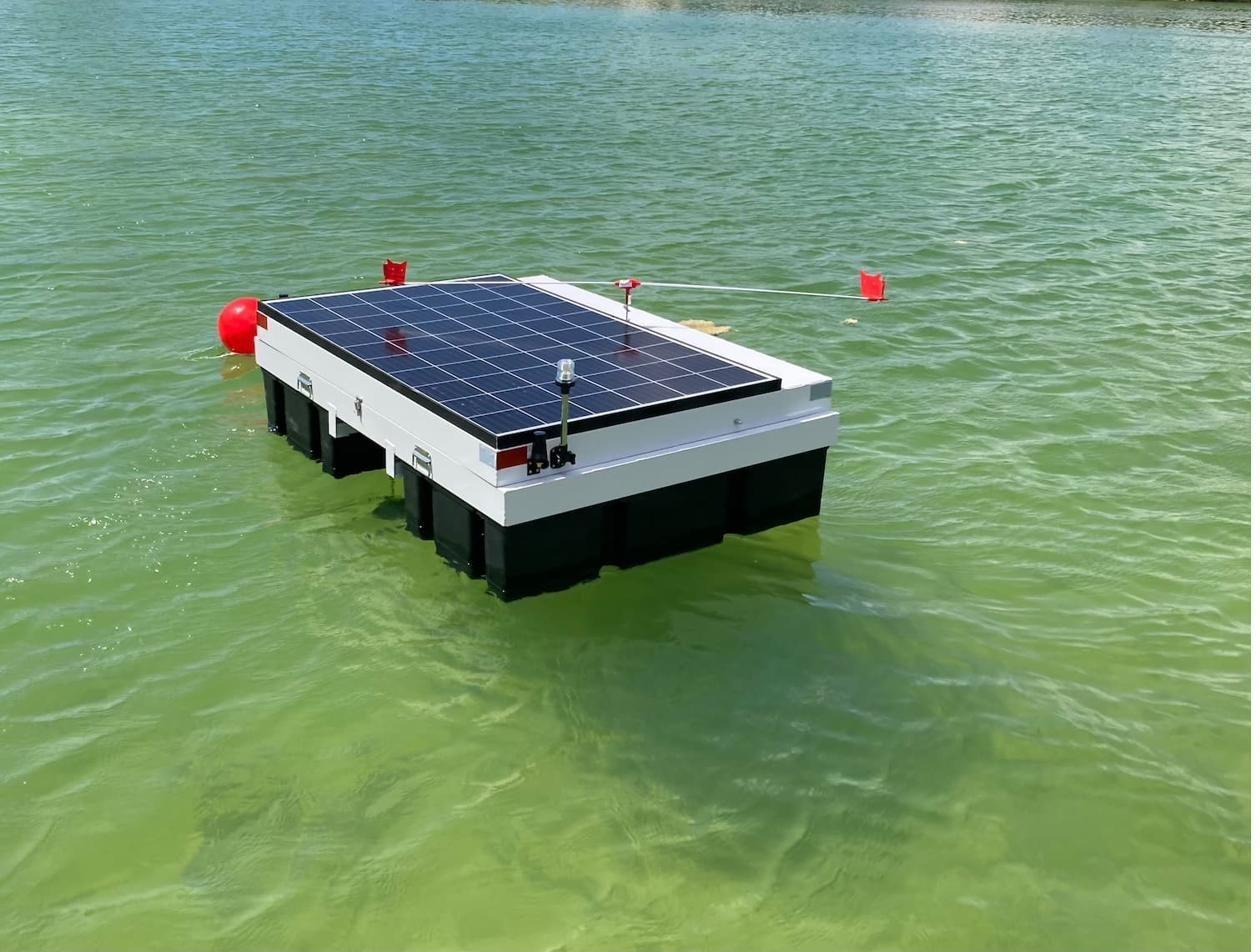 SonicPure Sentinel AIQ solar platform anchored on a lake.