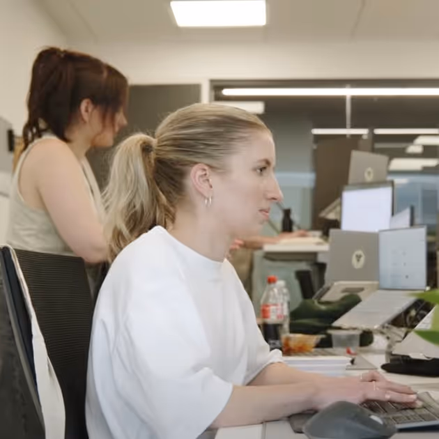 The Verticode team is working in the office.