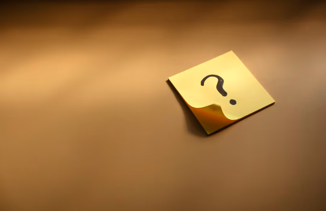 Question mark on a yellow post it note
