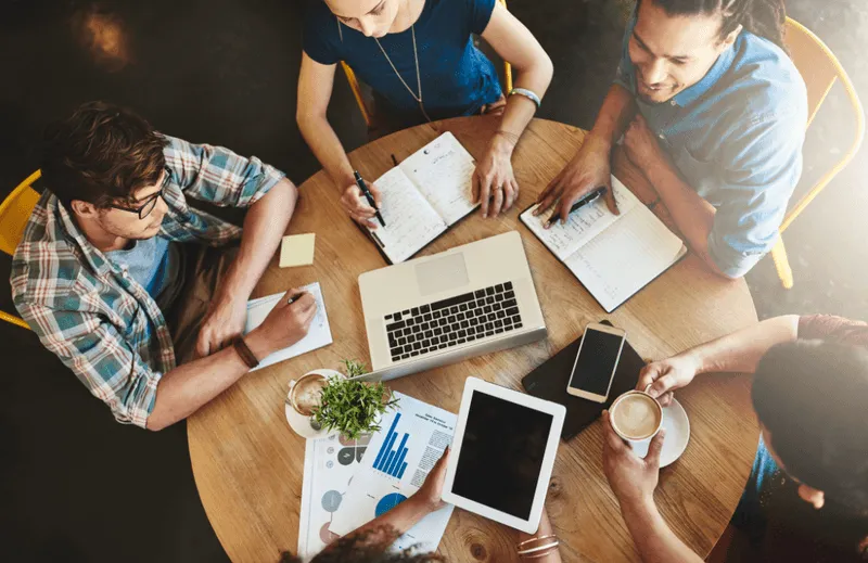 Group of people working on laptops
