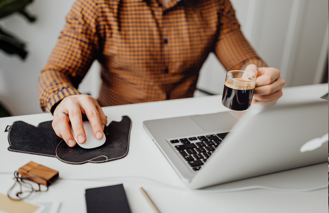 man sitting at laptop working