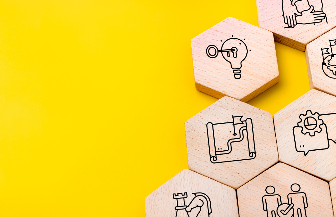 Wooden hexagon blocks showing business icons