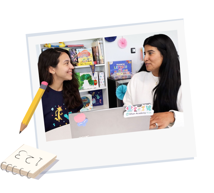 Two adults - a teacher and an implementation manager discuss a rollout plan for Khan Kids in a classroom setting. 