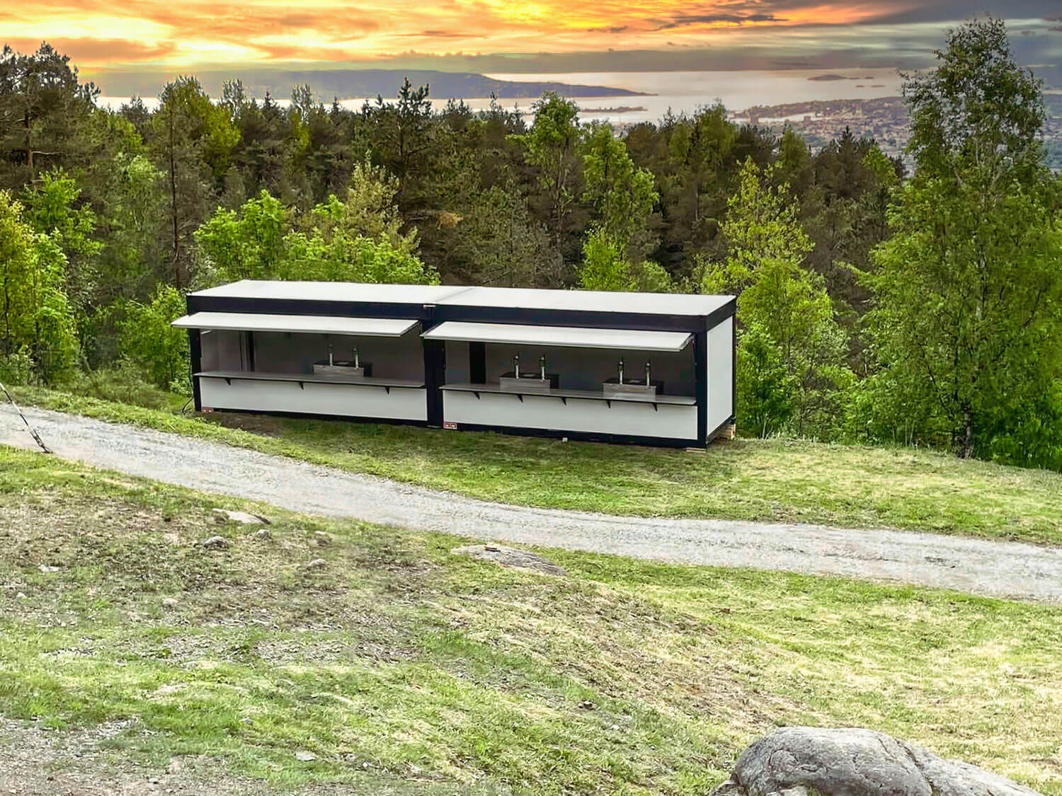Two linked CN Retail units in a rugged, forest environment.