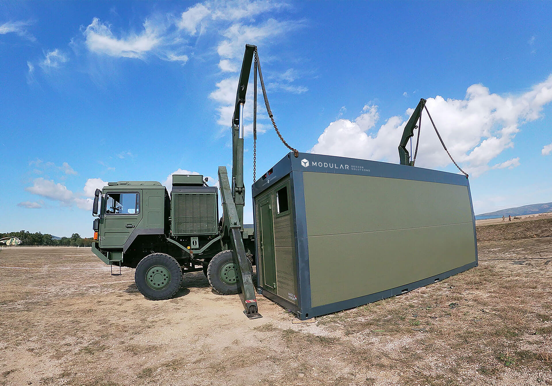 A CN20 unit equipped with enhanced privacy measures being deployed at a military base.  
