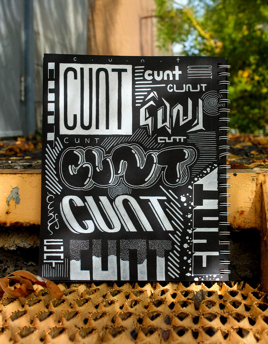 Graffiti tag lettering on a black page