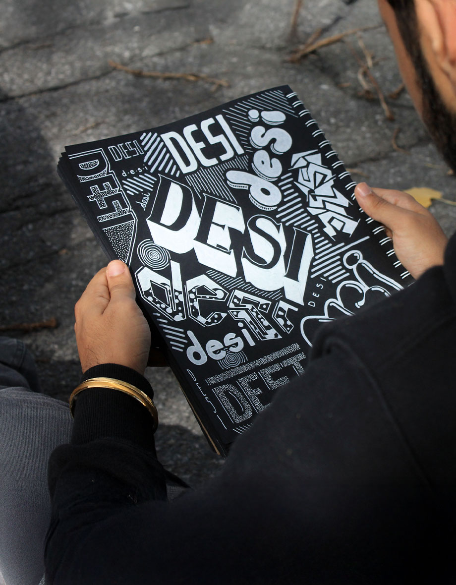someone holding a book that says desi all over the pages