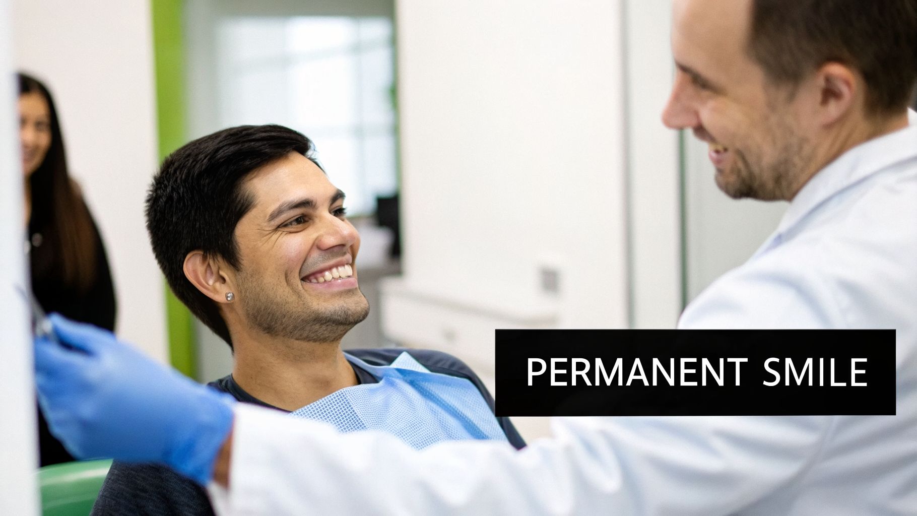 A smiling patient in a dental chair looks happily at a dentist wearing blue gloves, with text overlay 'PERMANENT SMILE'.