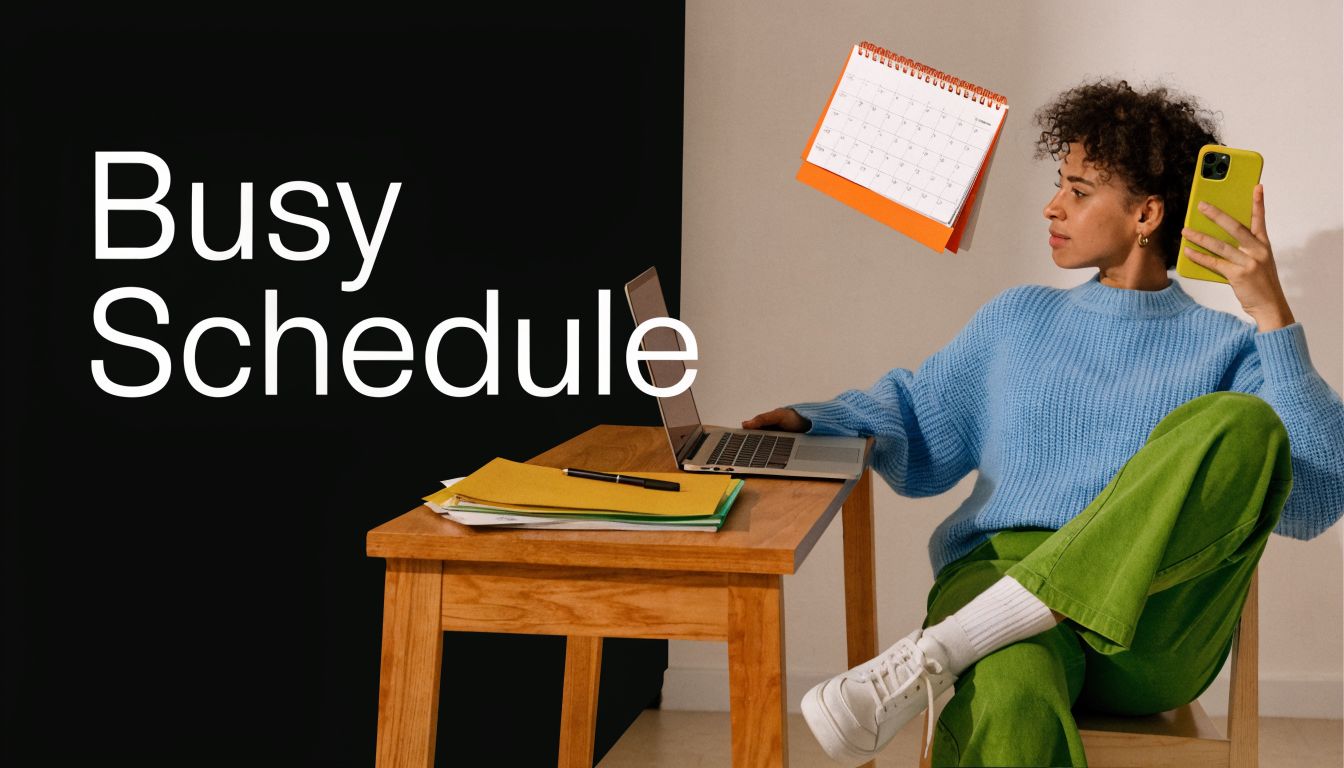A woman wearing a blue sweater and green pants sitting at a desk checking her phone.