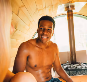 Happy patron enjoying the relaxing atmosphere of the Sásta Sauna wood-fired barrel sauna in Leixlip, Co. Kildare.