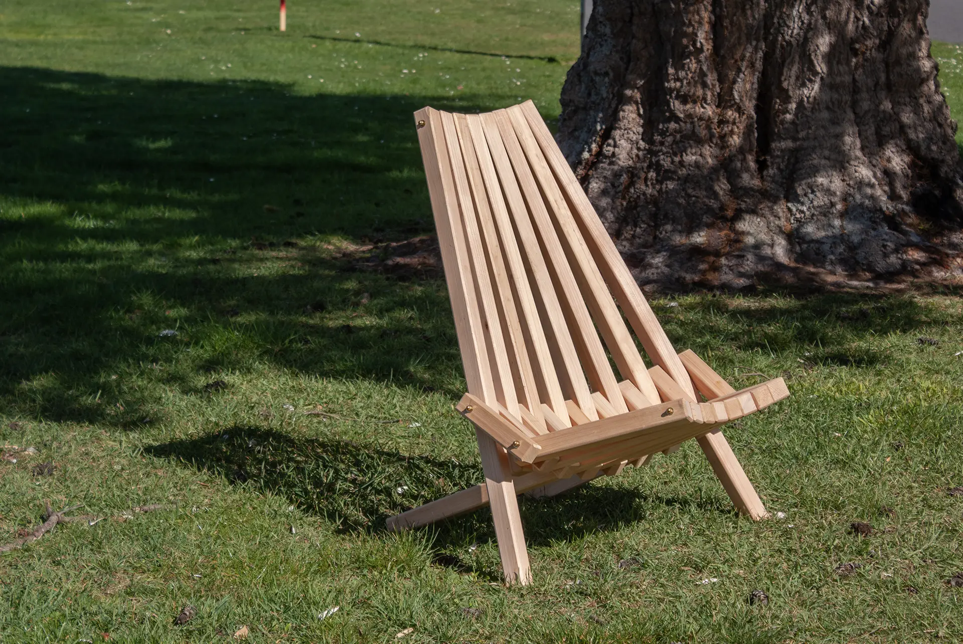 Rustic outdoor lounge seat crafted from macrocarpa wood