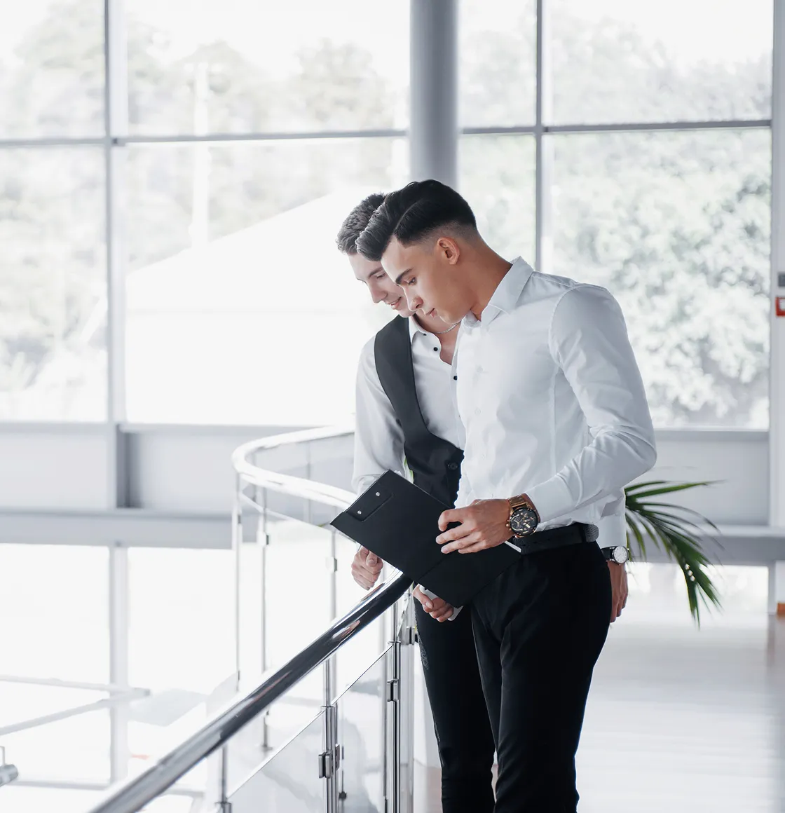 A couple of men standing next to each other.