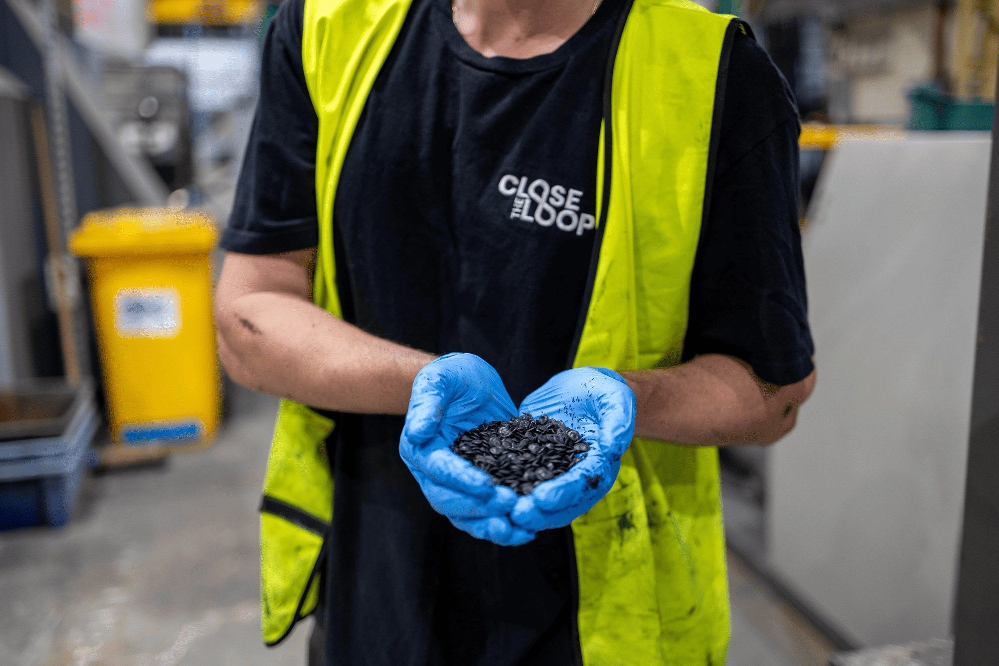 TonerPlas operator holding recycled pellets