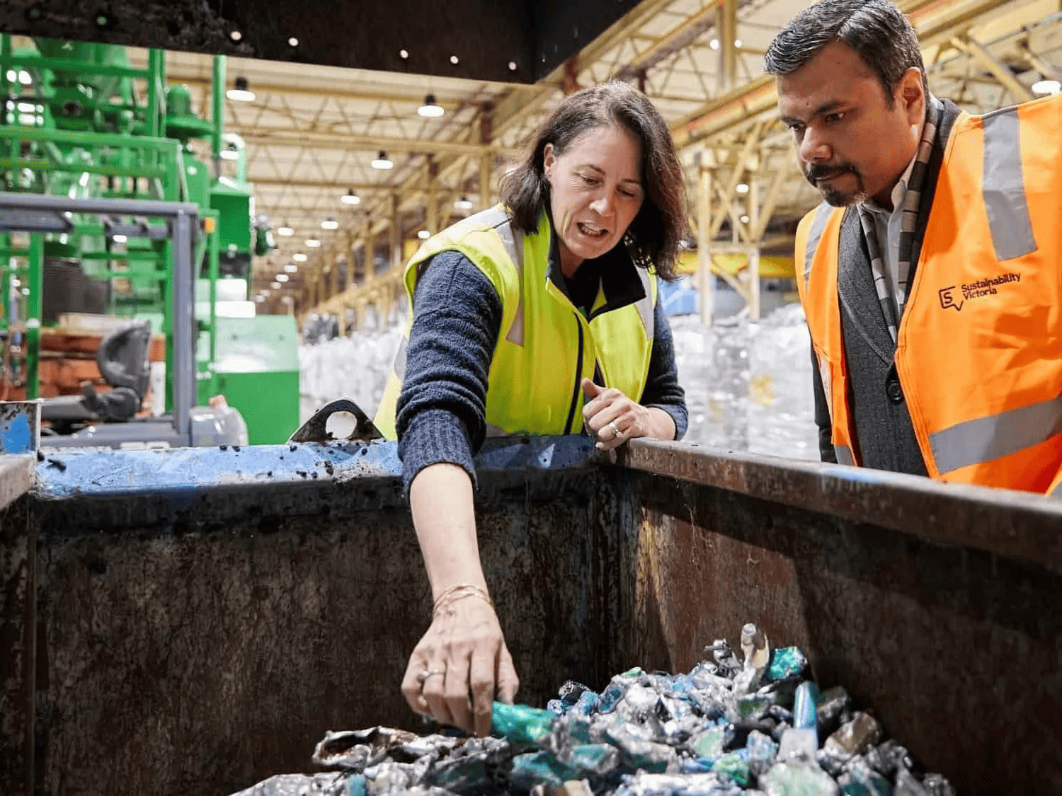 Factory tour guide showing cartridge recycling process