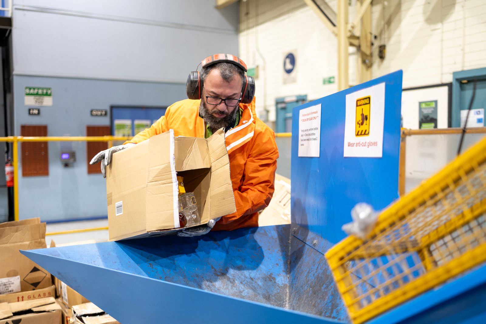 Worker sorting cosmetics packaging