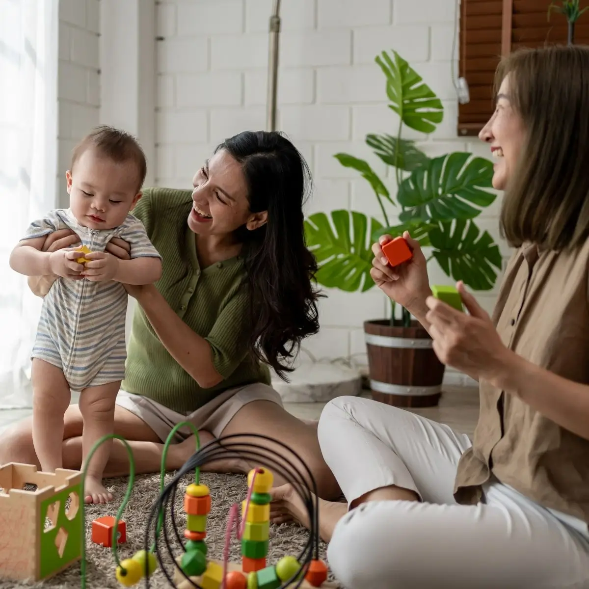 A mother having a parenting support counselling while playing with her baby