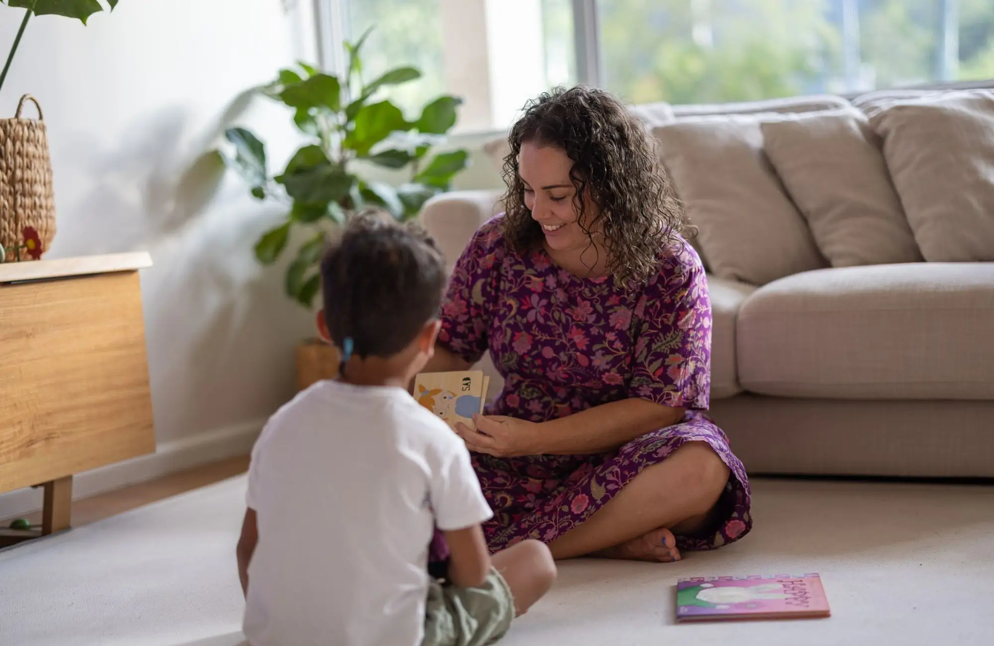Jakara counselling a young child with emotion cards
