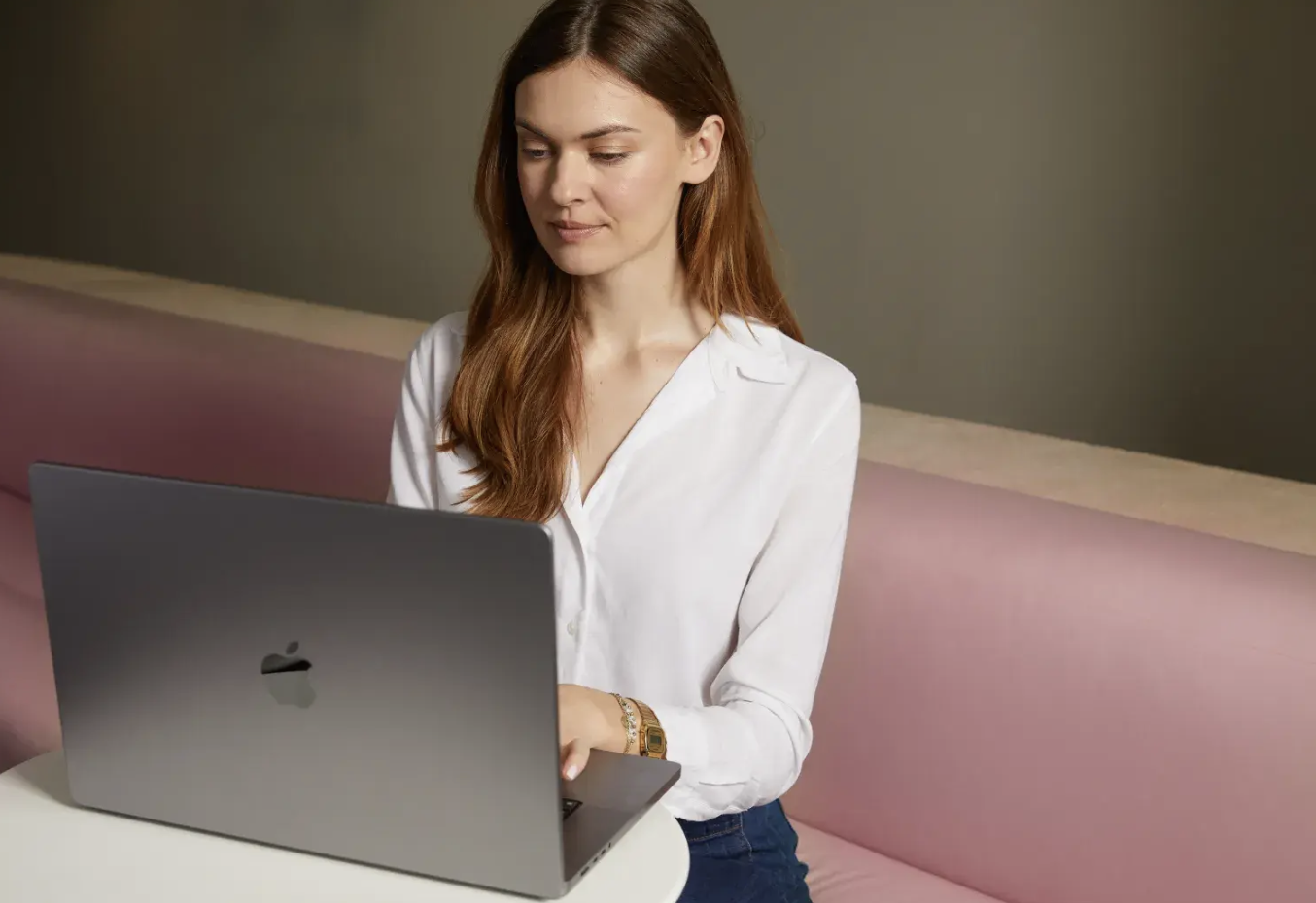 Photo of a woman on her computer.