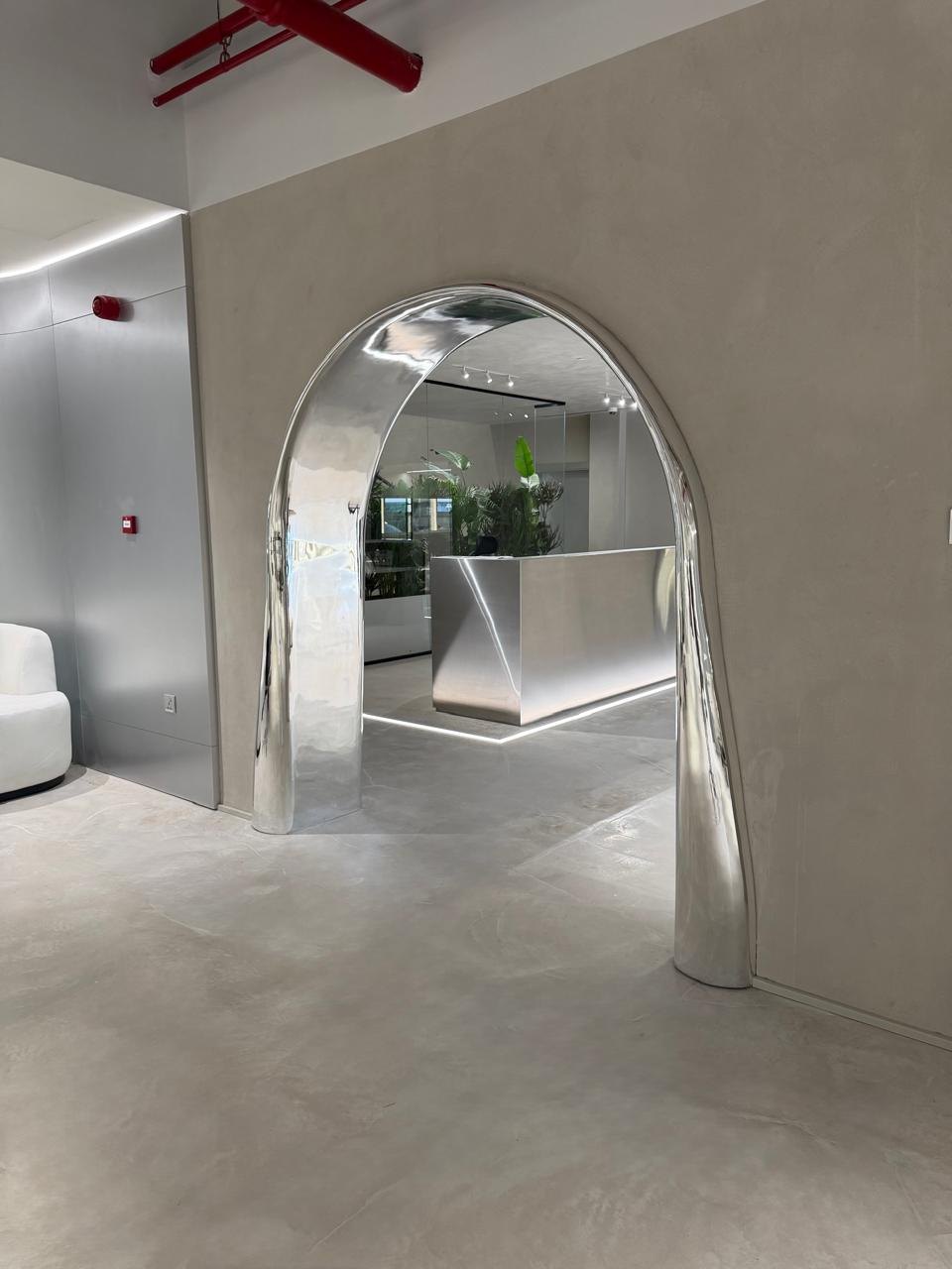 Sculptural mirrored archway to reception, creative studio, JAFZA