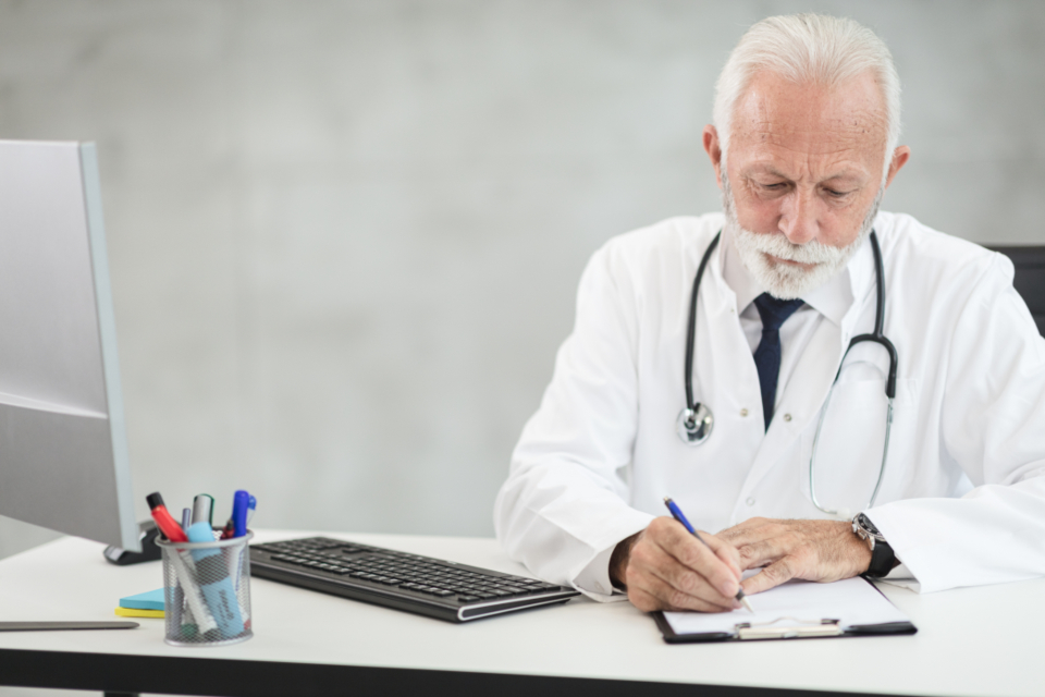 A clinician in consultation with a patient — Preventive Medicine