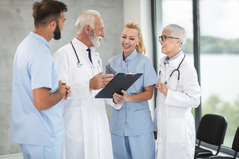 Health professionals in discussion around a table — Preventive Medicine