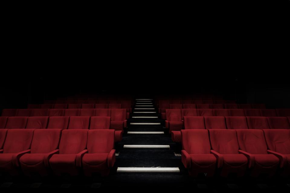 An auditorium prepared for a conference session — Precision Medicine & Genomics
