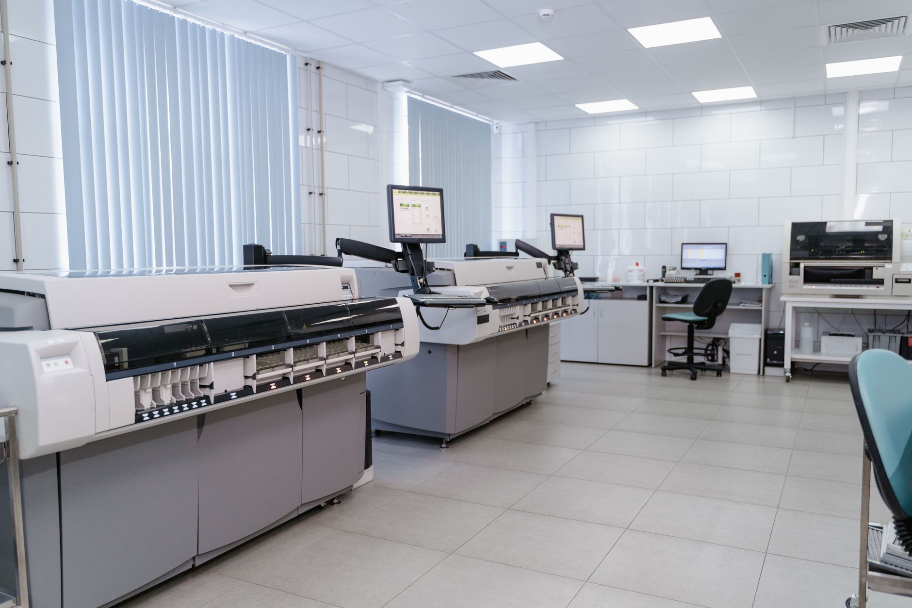Spacious laboratory interior featuring state-of-the-art machines and computers for research purposes — Precision Medicine & Genomics