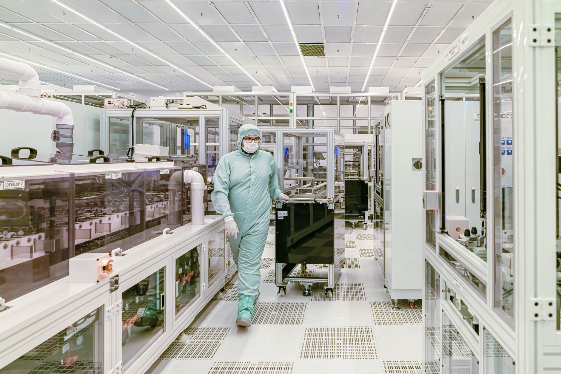Scientist in protective gear walking in a high-tech cleanroom laboratory environment — Regenerative Medicine