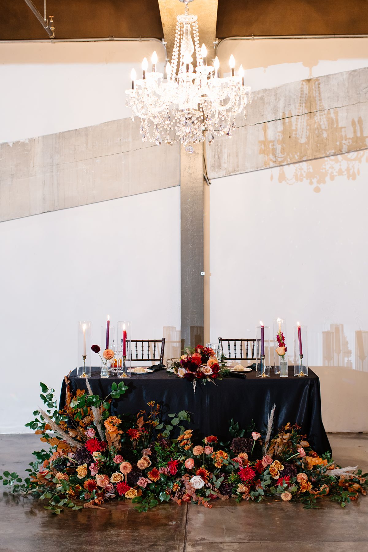 Couple sharing their first kiss during a small indoor wedding ceremony in Pennsylvania, surrounded by loved ones.