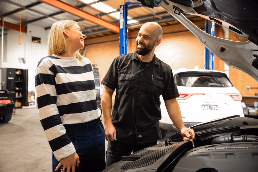 a happy customer with the workshop technician at the european-auto-vechicle-repair-and-servicing-specialist-wollongong-grease-and-oil