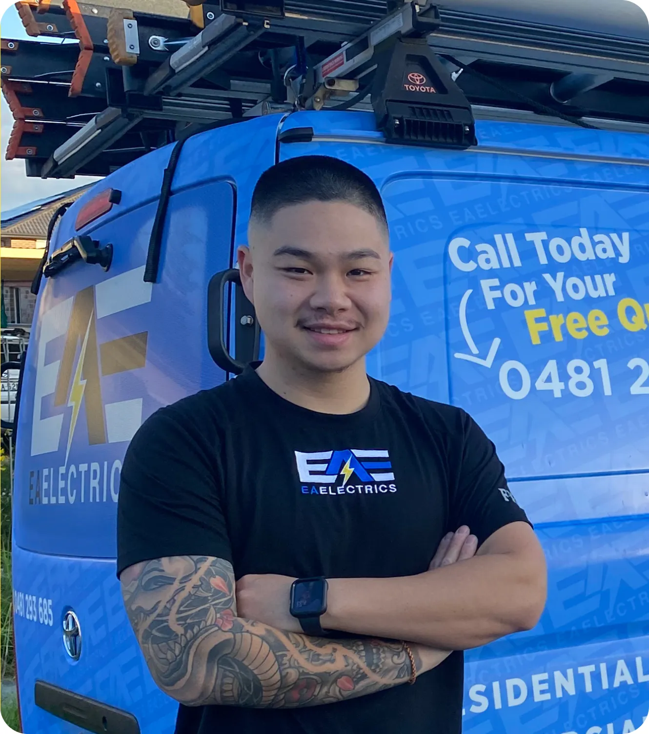 Patrick from EA Electrics standing with the company's service van