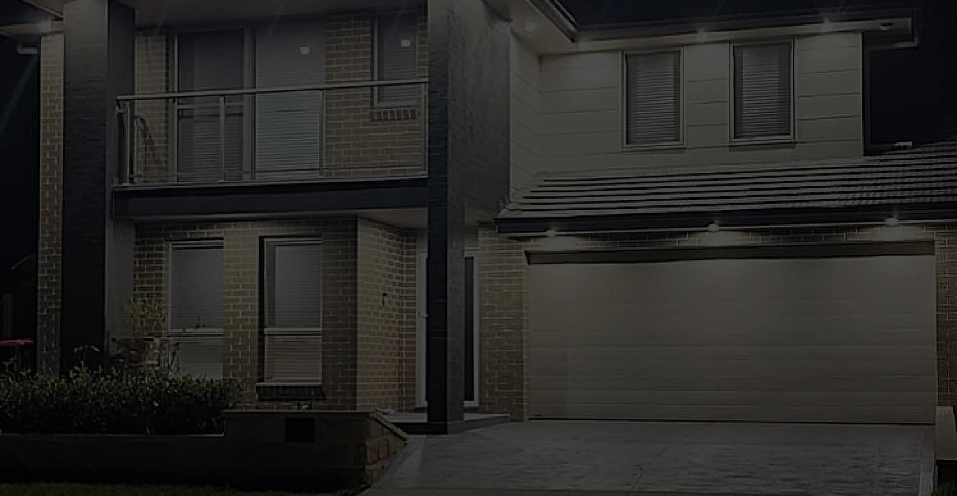 Image of a house brightly lit with lights
