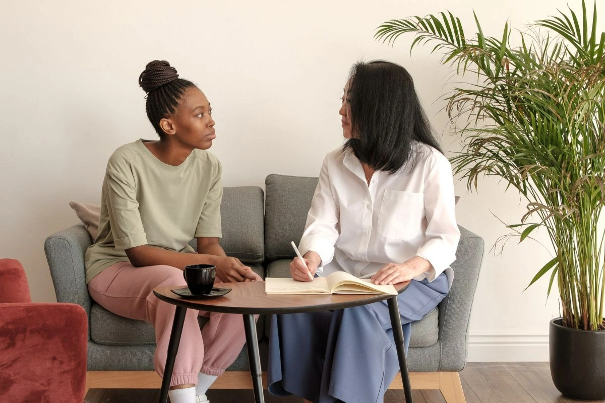 Photo of a woman having trauma counselling with a therapist