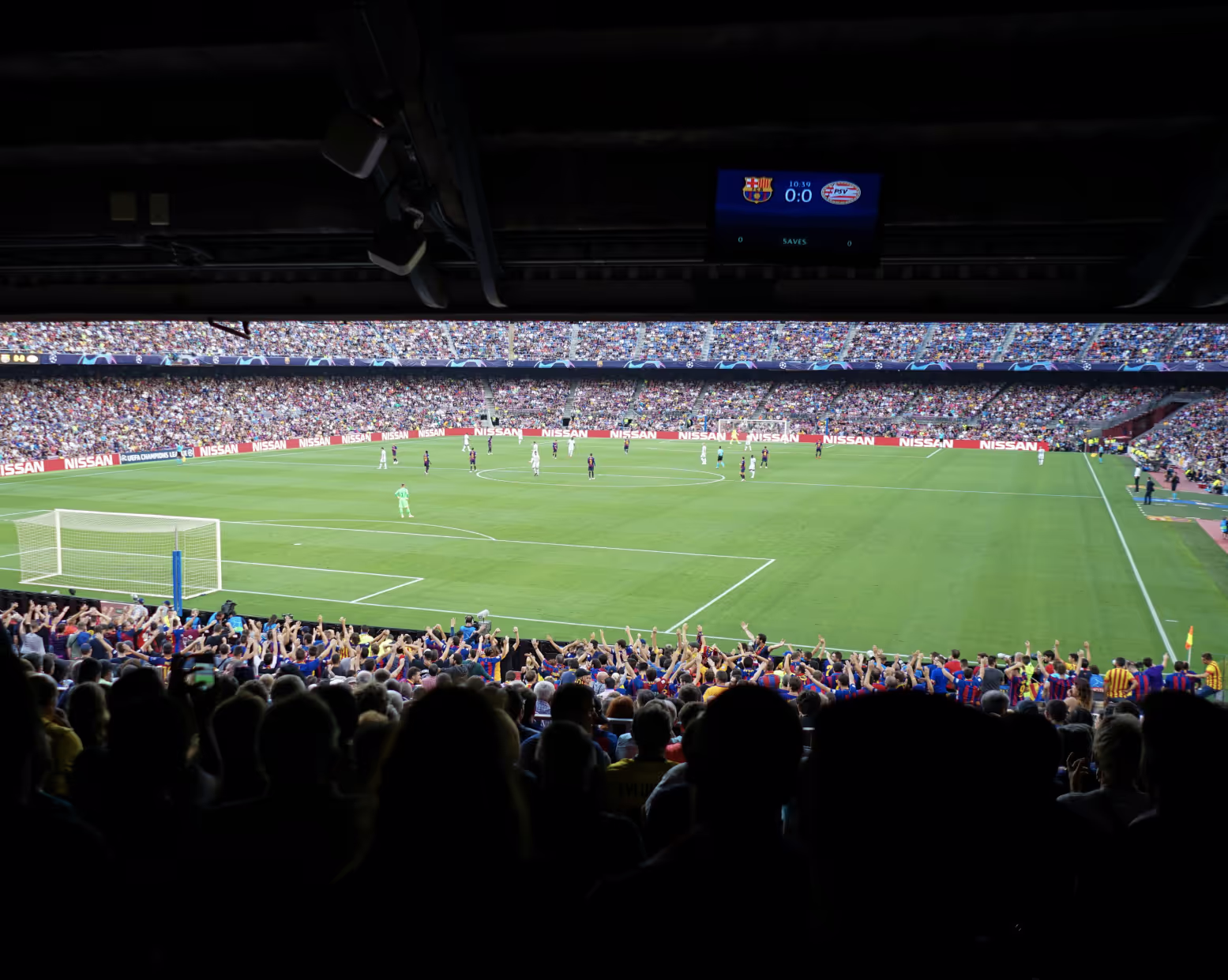 Football stadium match from crowd stands.
