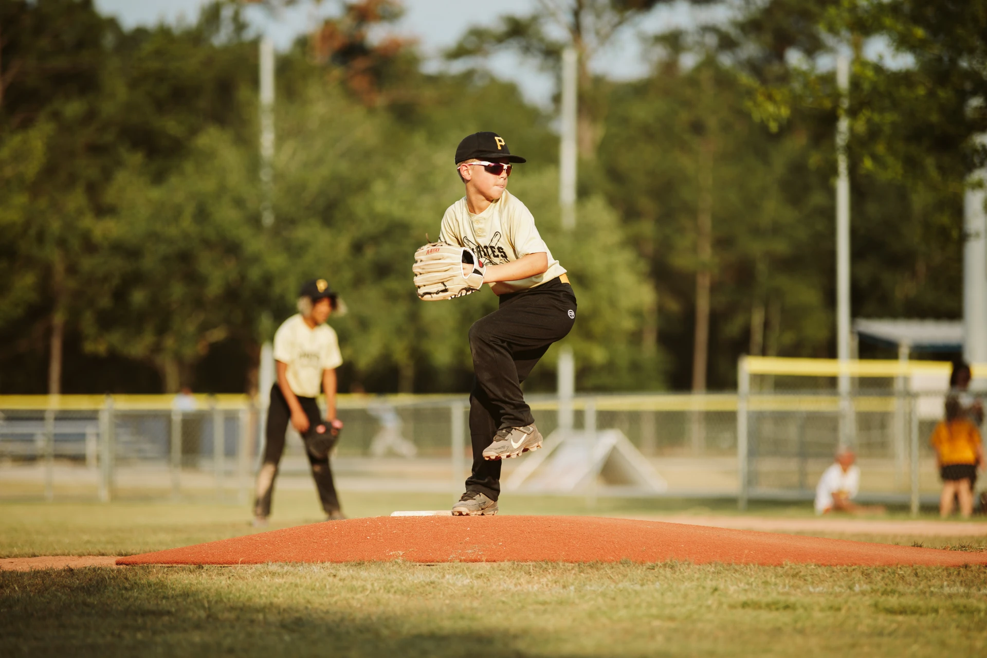 Kid pitching on mound