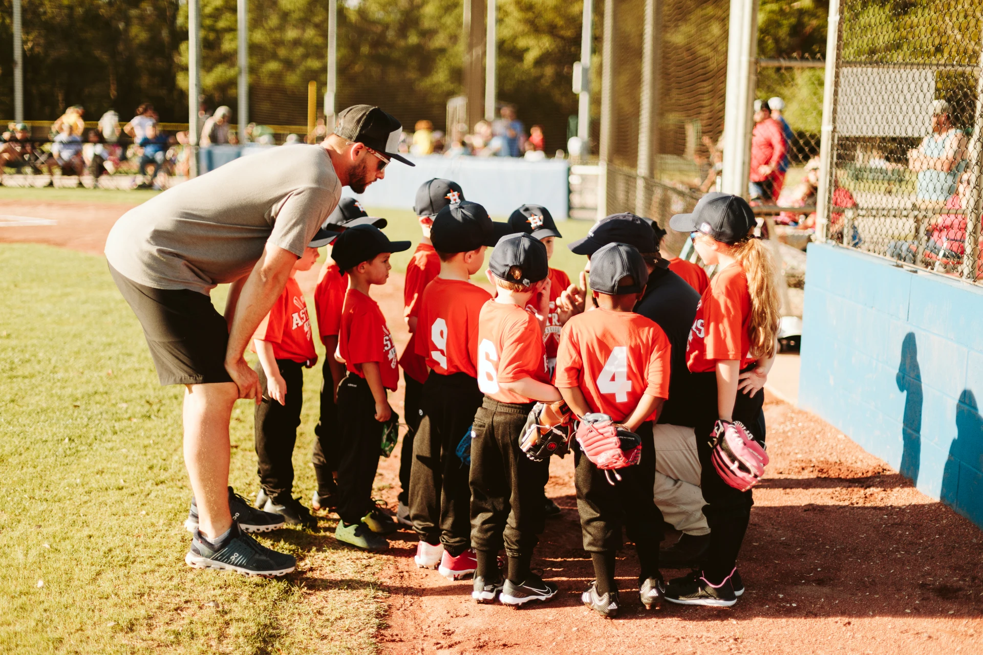 Kids in huddle playing baseball