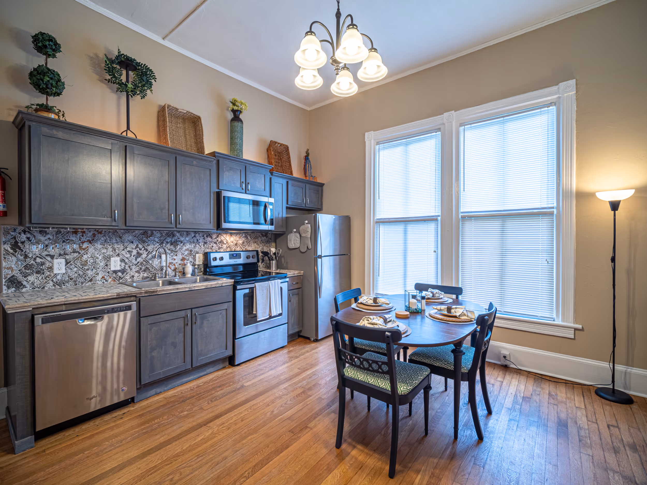 Living room with fireplace and hardwood floors at Victorian Village Apartments in Marietta GA