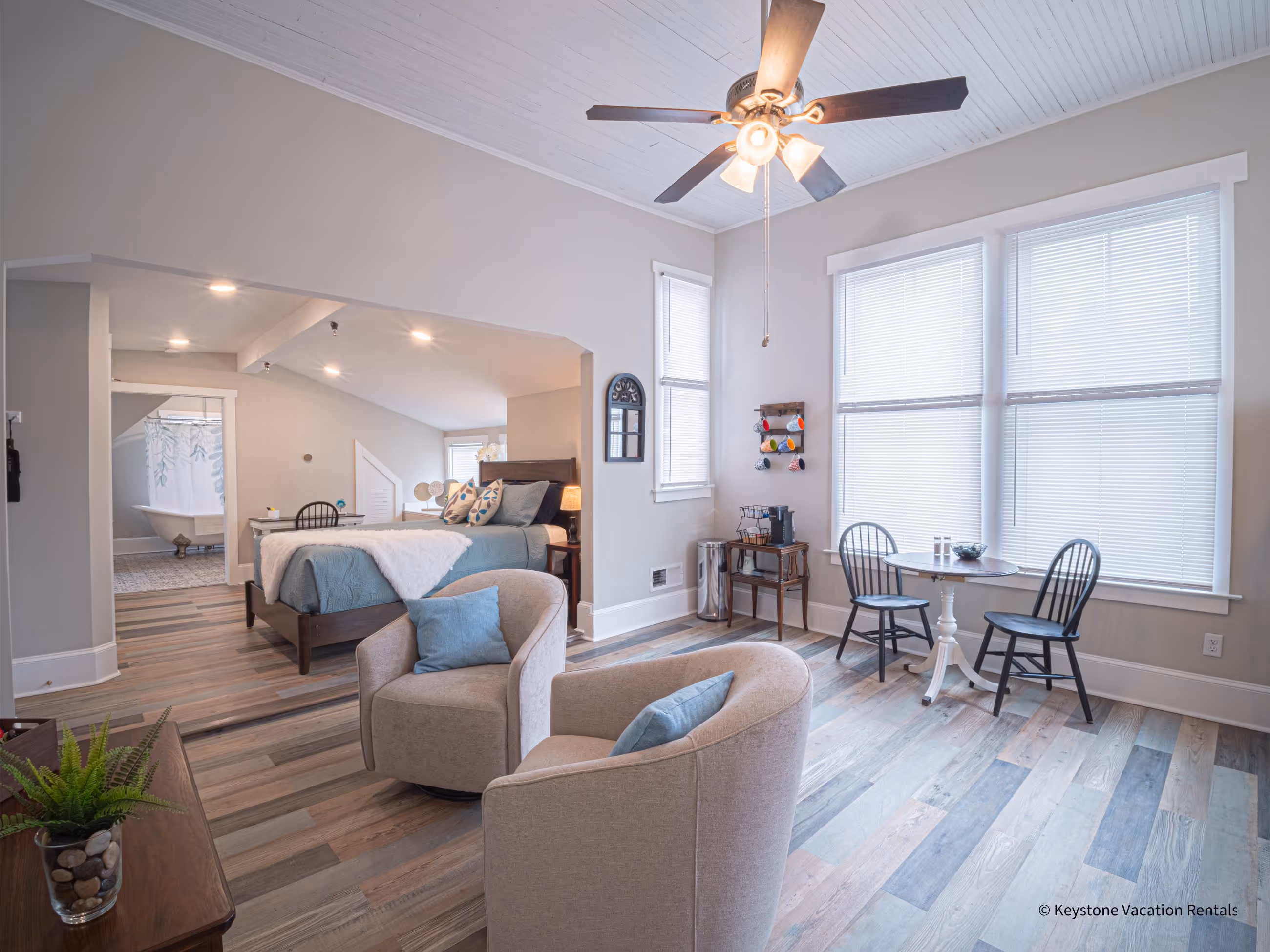 Open-plan living room and kitchen interior at Victorian Village Apartments in Marietta GA