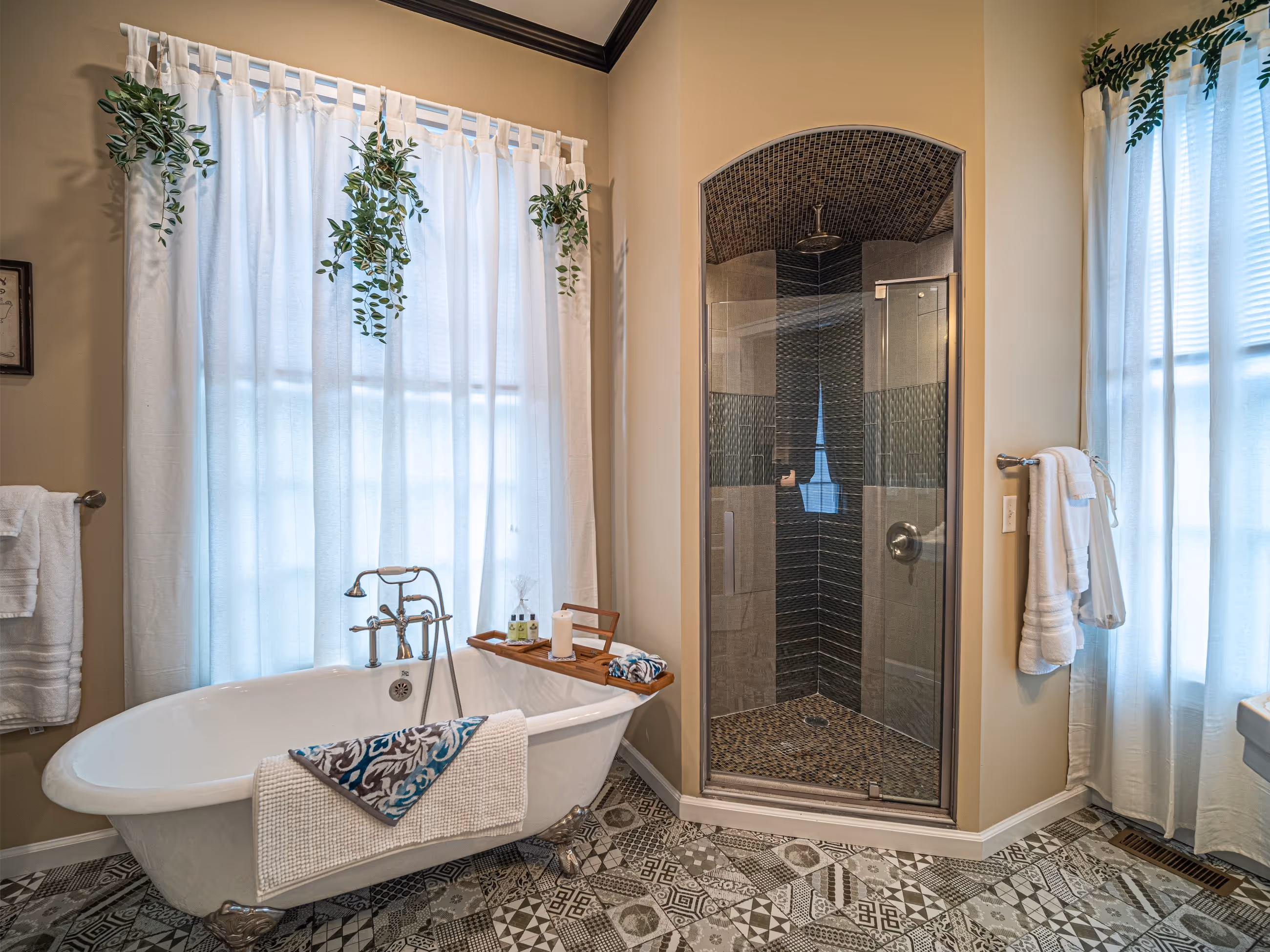 Bathroom with clawfoot tub and modern shower at Victorian Village Apartments in Marietta GA