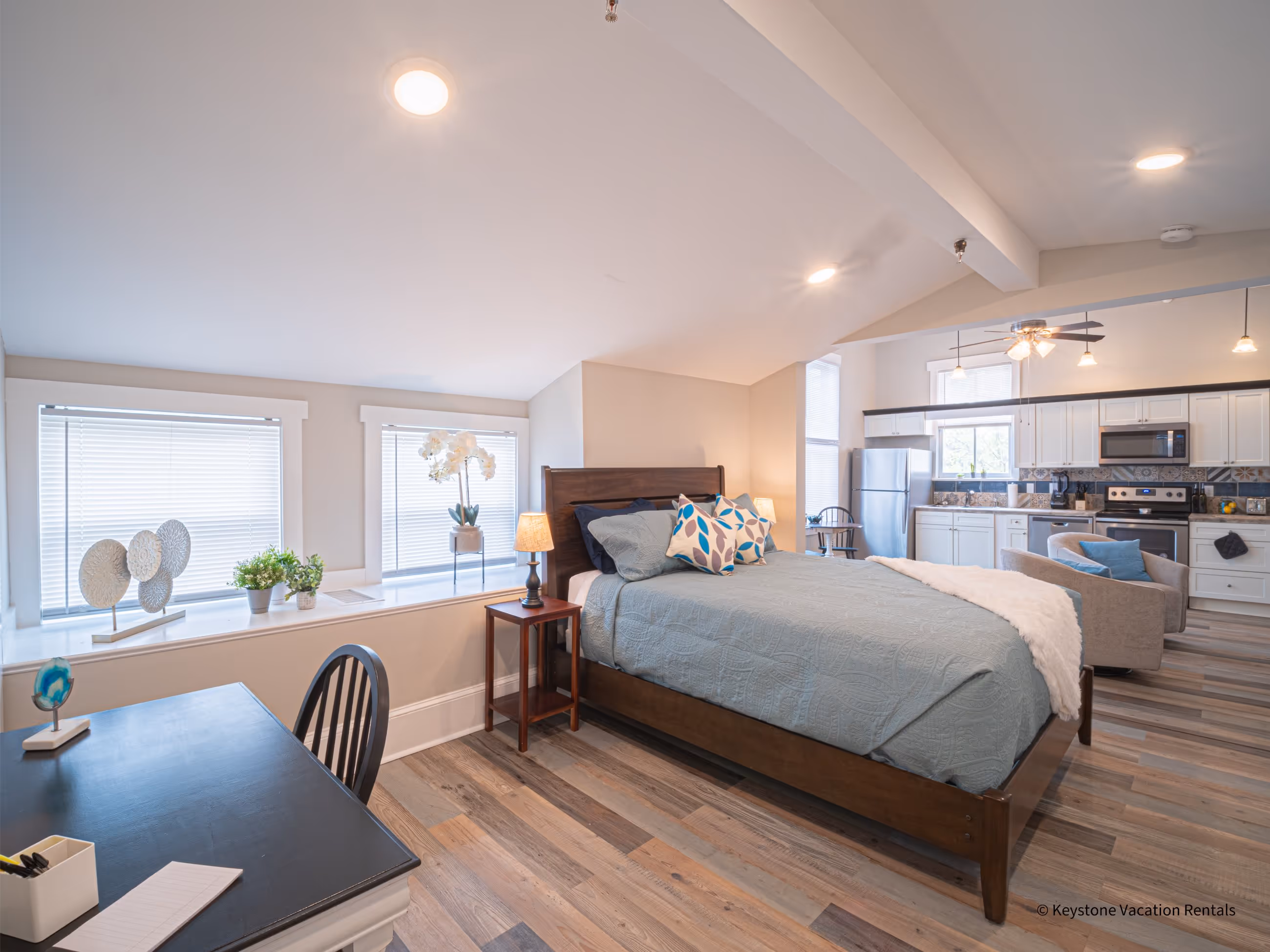 Victorian Village apartment bedroom with queen bed and nightstands in Marietta GA