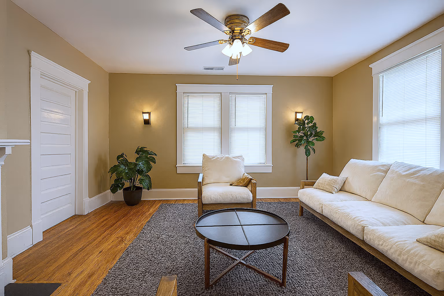 Living area with plush sofa in a two-bedroom apartment at Victorian Village Apartments in Marietta GA