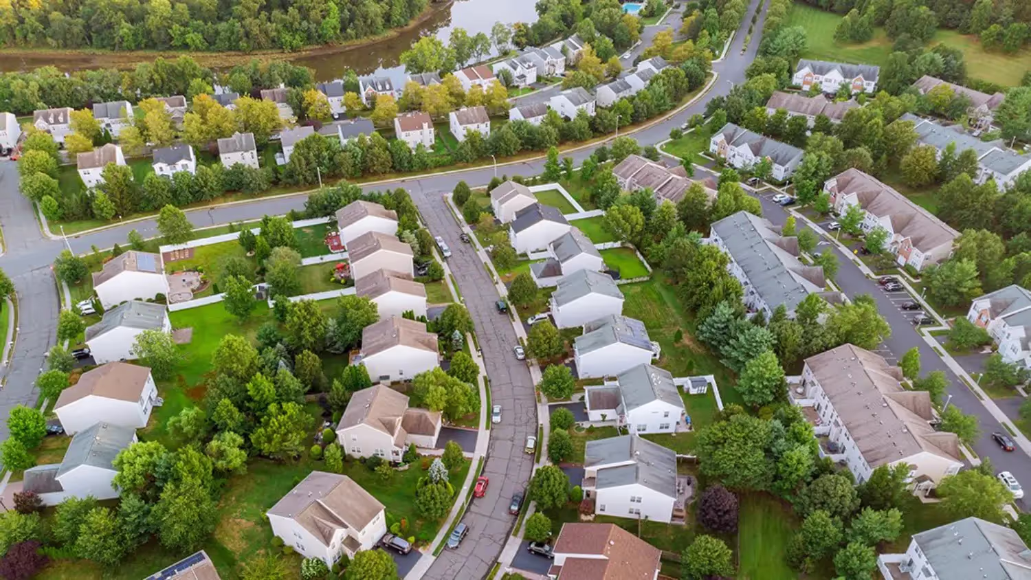 Aerial view of Victorian Village Apartments community with tree-lined streets and manicured lawns in Marietta GA