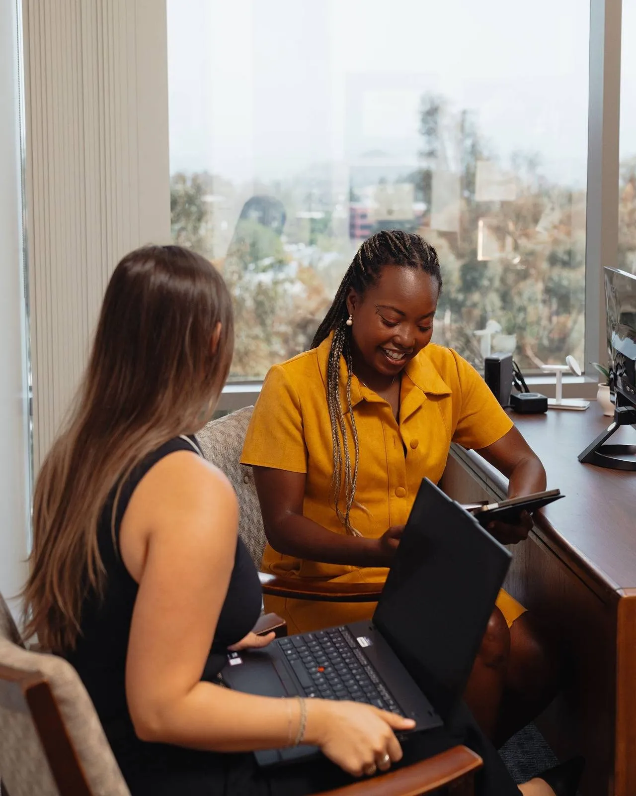 Cage & Miles employees working together in office.