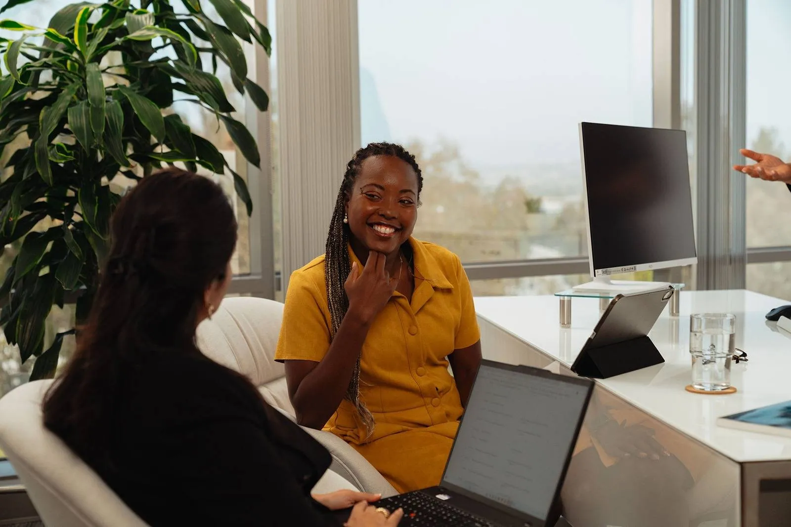 Cage & Miles employees working together in office.